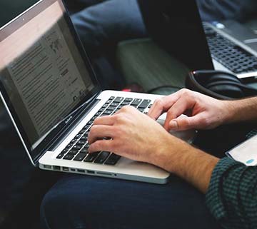 Man with computer, photo from Pixabay